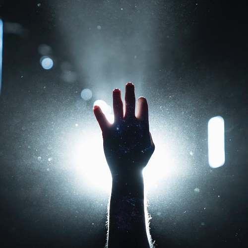 united states person's hand on light light